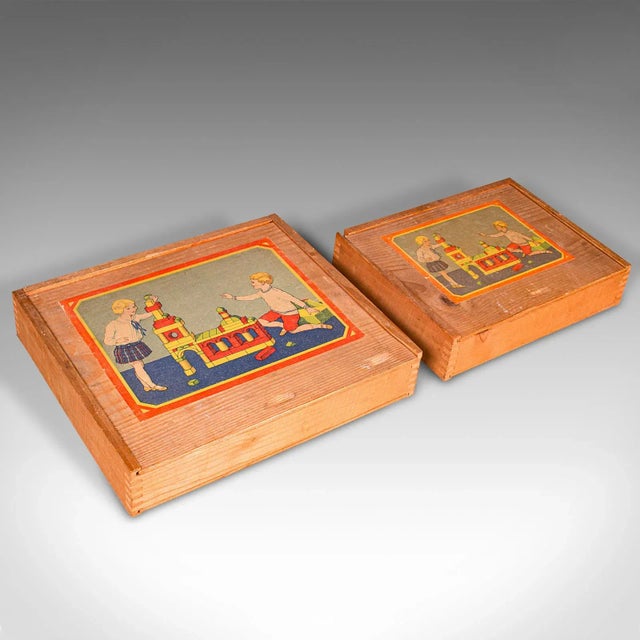 This is a set of two vintage building block cases. A German, pine toy box or baukasten in the manner of Froebel, dating to...