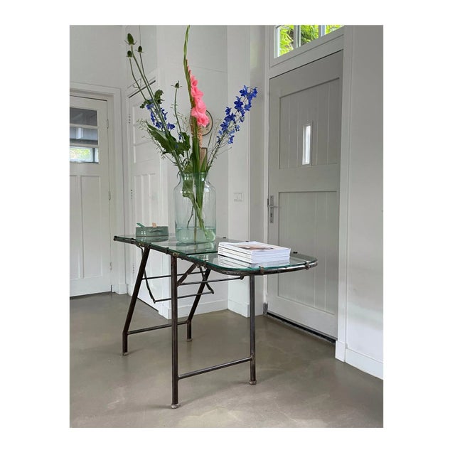 Antique examination table customized as side-table. Frame is made of steel which has a great patina. On its frame there...