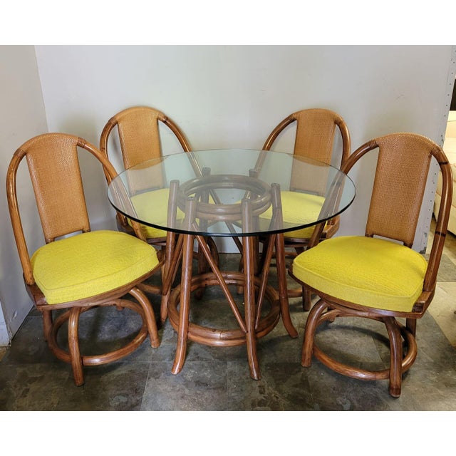 Four Rattan Swivel Chairs With Matching Table and Yellow Upholstery For Sale - Image 11 of 12