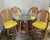 Four Rattan Swivel Chairs With Matching Table and Yellow Upholstery For Sale - Image 11 of 12