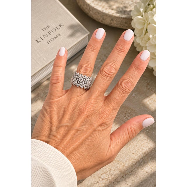 An exceptional wide diamond band by Italian master jeweler Roberto Coin, exquisitely crafted in 18 karat white gold and...