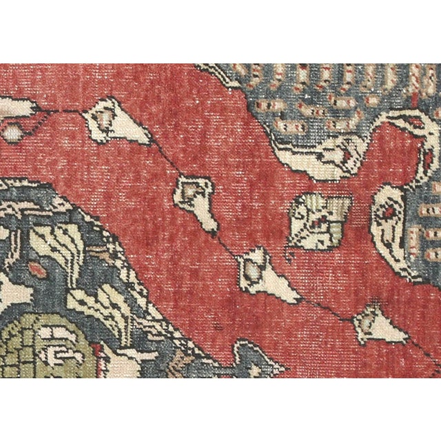 Handwoven wool-on-wool Oushak rug from vintage Turkey, measuring 4'10" x 7'4". Originating from the storied weaving...