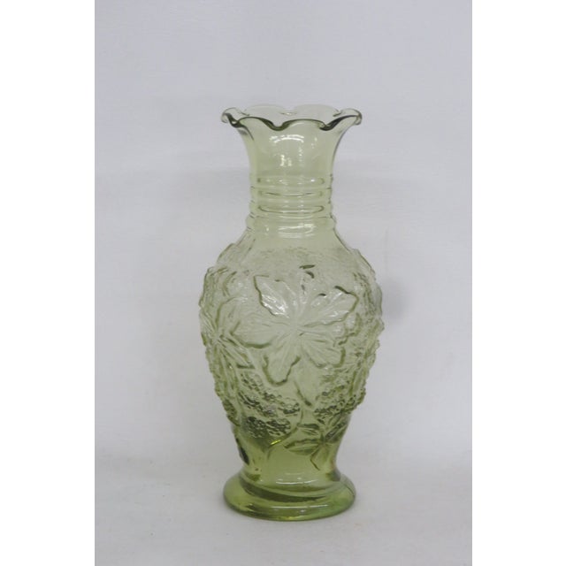 This classic vase is made of glass. This vase has a lovely small silhouette, Features a Raised Leaf and Berries Pattern,...