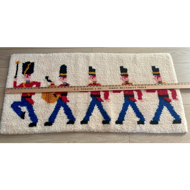 Beautiful Rya, latch hook rug featuring a line of marching Danish soldiers, a prominent holiday theme in elegant, mid...