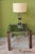 Italian-style side table, handcrafted from welded metal with a chrome finish and curved walnut wood, held together with...