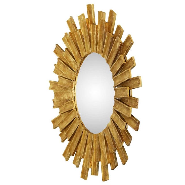 A charming mid-century carved wood sunburst mirror finished in a rich gilt tone. The scale and sculptural ray design add...
