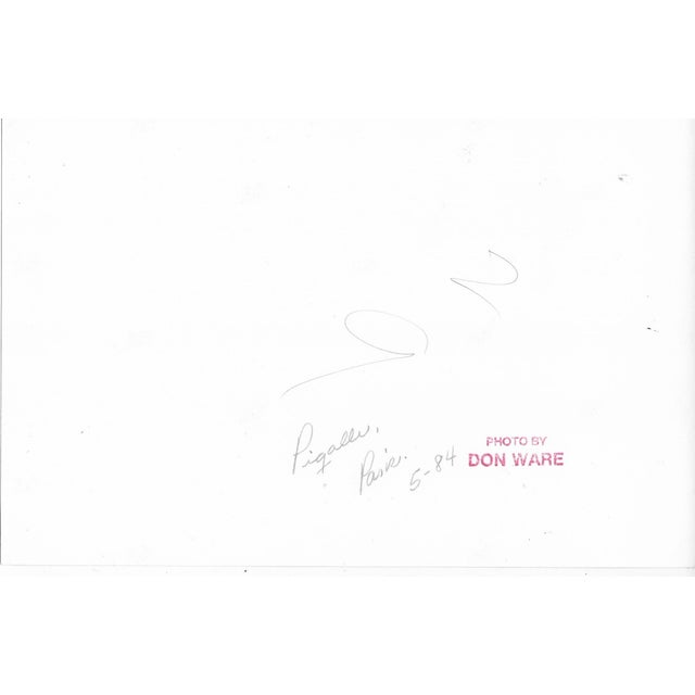 Black and white photo of the Pigalle area of Paris, France by Los Angeles photographer Don Ware (1921-2006). Title and...