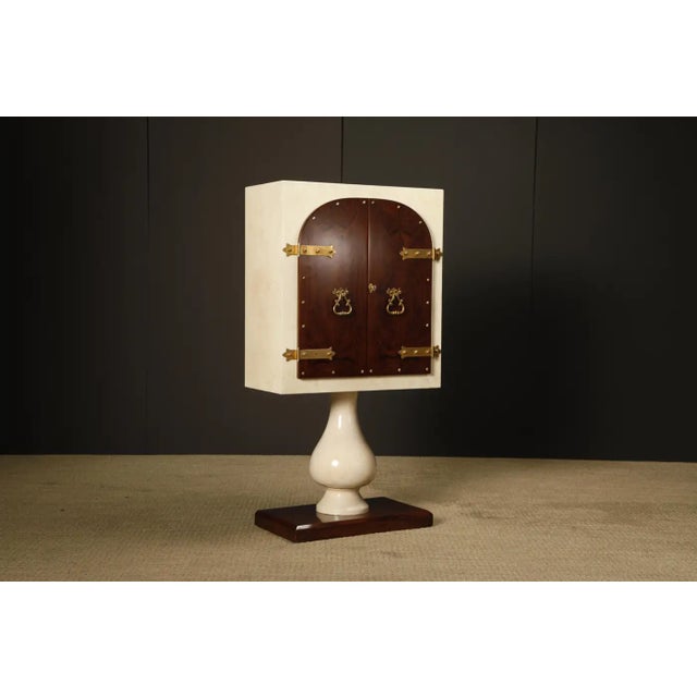 A freshly refinished Aldo Tura dry bar cabinet, crafted in Italy circa 1950s, showcasing Tura’s signature mix of luxury...