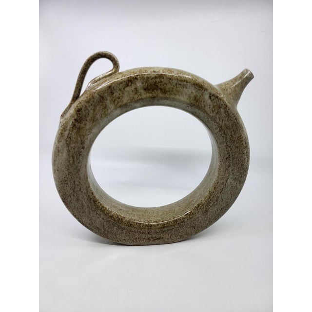 Superb and rare ring bottle (or crown jug) in hand-glazed stoneware, dating from the 1960s-1970s. Inspired by the ancient...