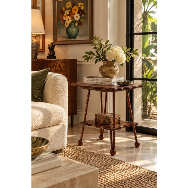 Beautiful antique Arts & Crafts style two-tier oak accent table featuring a distinctive scalloped tabletop, intricately...