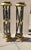 Black and gold-trimmed pedestals. Wooden and gilt pedestals, painted satin black and edged with gold-leaf trim. Very well-...