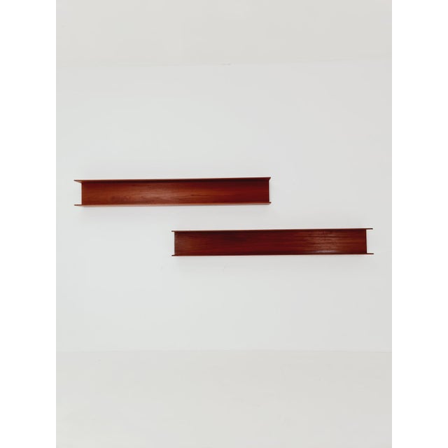 Long teak hanging shelf by Wilhelm Renz for Walter Renz, 1960s. Design year: 1960s. Dimensions per shelf: 20 cm diameter x...