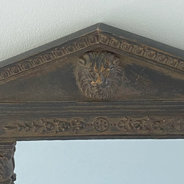 Small vintage faux bois Korean wall mirror with “carved” lion’s head and detail on the sides. This piece, which is stained...