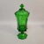 A classic Fostoria Glass Company covered compote in the celebrated Coin pattern (#1372), produced in rich emerald green...