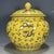 A striking Chinese porcelain ginger jar featuring a vibrant imperial yellow ground, hand-painted with dynamic dragons...