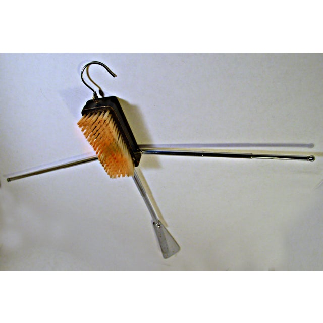 This listing is for a Swank telescopic travel tool. It has a shoe or clothing brush, a shoe horn and even has arms that...