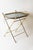 This high-quality folding table is crafted from brass and beautiful smoked glass. This beautiful table is elegant and...