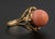 18K Gold and Angel Skin Coral Ring, distinguished by its warm blush-coral colored cabochon and graceful openwork setting....