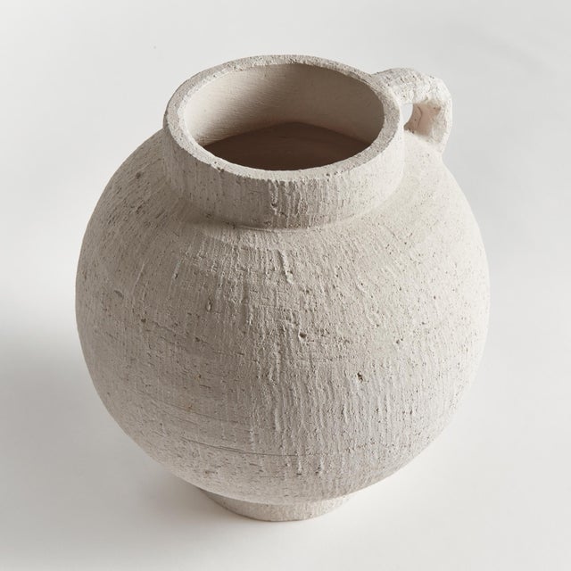 Amphorainspired vessel with a modern sensibility, this vase is made to inhabit the contemporary space. Handthrown with a...