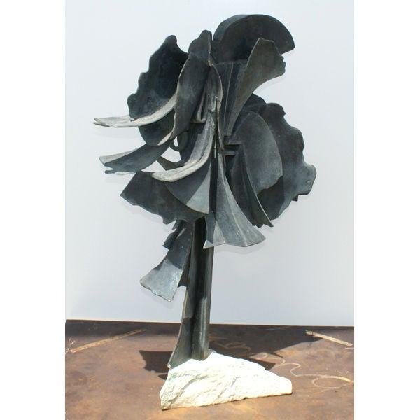 An abstract sculpture made by the well-known American artist Edmond Casarella (1920-1996). An intricate cast bronze design...