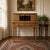 Vintage American maple flip-top secretary writing desk with bun feet, a charming 20th century reproduction of a colonial...