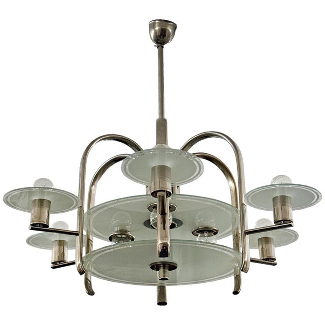 An elegant Functionalist chandelier dating from the 1930s, featuring a chromed metal structure combined with frosted...