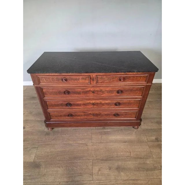 An authentic antique piece of furniture with a classic design that exudes elegance and sophistication. Featuring five...