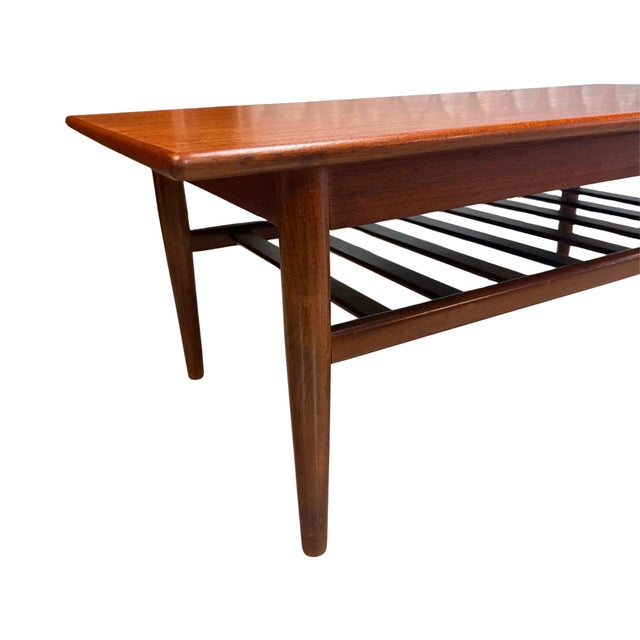 Vintage mid-century modern teak and Afromosia coffee table with slatted shelf designed by V.B. Wilkins for G-Plan of High...