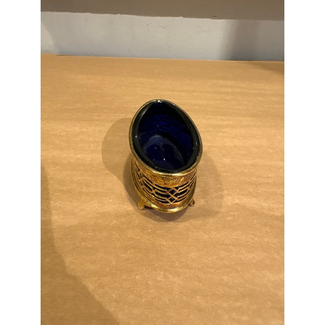 This is an antique salt cellar. The stunning cobalt glass is removable from the outer metal piece. This would look...