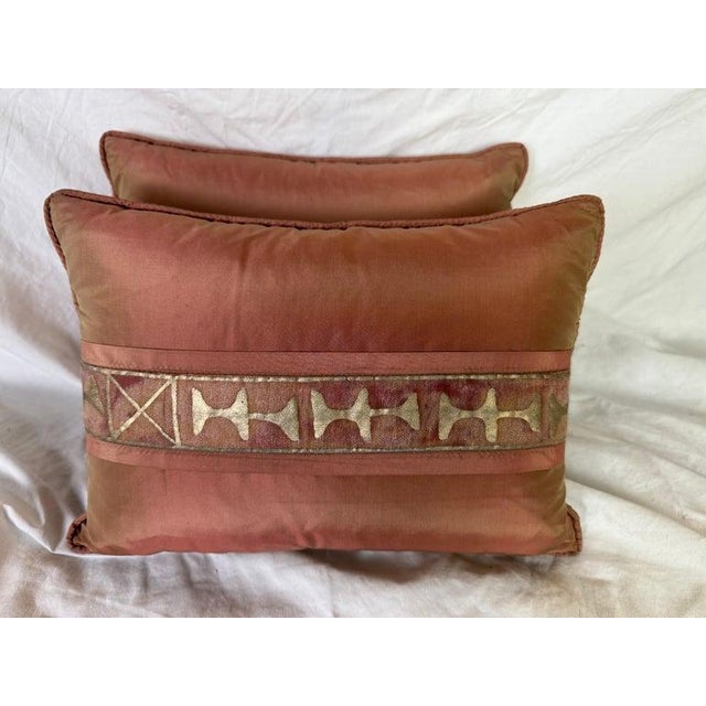 This pair of pillows features a striking design that marries antique elegance with modern sophistication. A central...