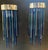 Lamps made with numerous colored glass rods attached to an iron frame, covered with a brass band. The glass shades range...