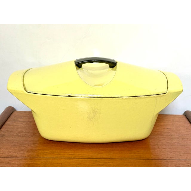 Le Creuset "La Coquelle" casserole dish designed by industrial designer Raymond Loewy in 1958. Clean inside with basket...