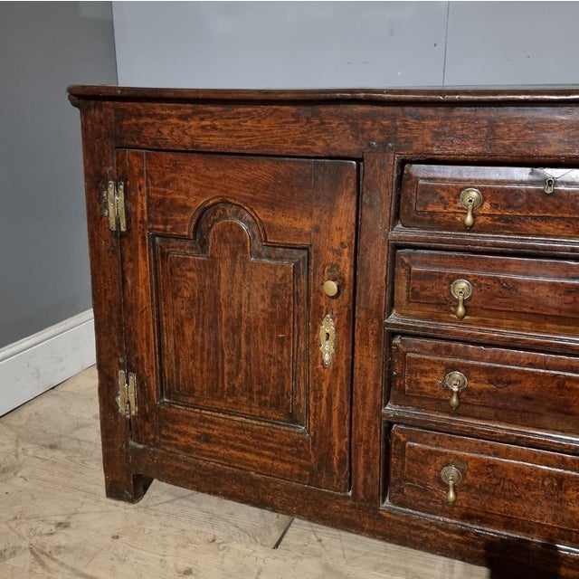 Good 18th C English period oak dresser base. Wonderful colour. 1740. This piece is designed in the style of the selected...