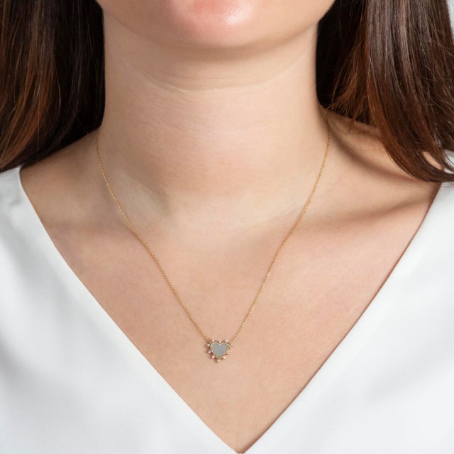 This white mother of pearl heart surrounded by diamonds is again a great twist on a classic. N/A; 16-18 inches Exact...