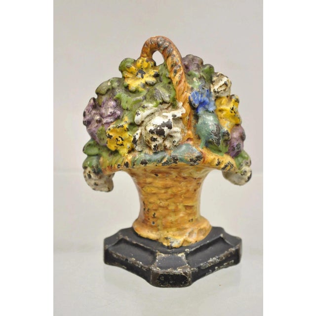 Antique Victorian Cast Iron Figural Floral Bouquet Basket Painted Door Stop. Circa Early 20th Century. Measurements: 6" H...