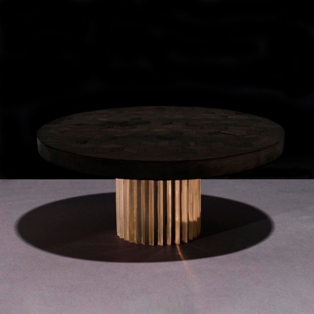 Dining table with ebonized Oak top from old Italian wine barrels and multifaceted pedestal in cast bronze. Inspired by...