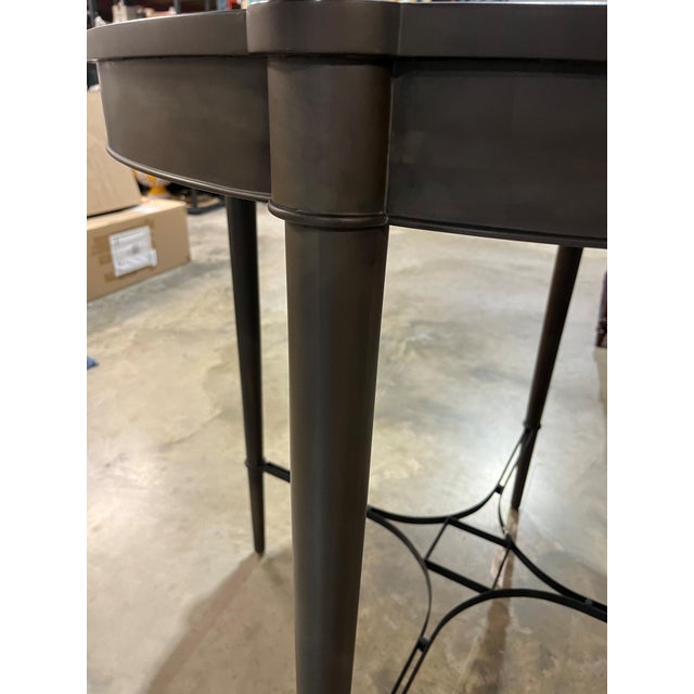 This stately bistro table is a fitting addition to a luxurious games room or home bar. The espresso and chocolate satin...