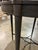 This stately bistro table is a fitting addition to a luxurious games room or home bar. The espresso and chocolate satin...