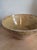 This French glazed terra cotta tian bowl in warm cream and honey tones is the kind of object that earns its place without...