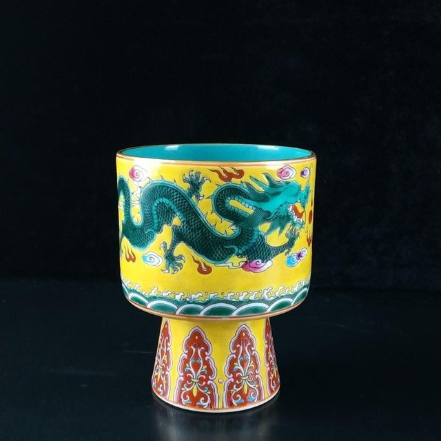This vibrant vintage porcelain vessel is crafted in the classic "stem cup" (gaozubei) form, historically used for wine or...