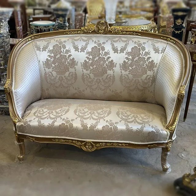 Loving the style. Beautiful big sofa with white upholstery and gold details. Fully refinished in new gold and padding. We...