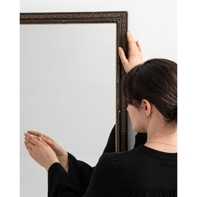 A mirror whose dark bronze thin frame, rectangular gives it real character at first glance. Originating in France during...