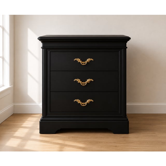 A beautifully refinished pair of vintage French Provincial three-drawer nightstands featuring a rich satin black finish...
