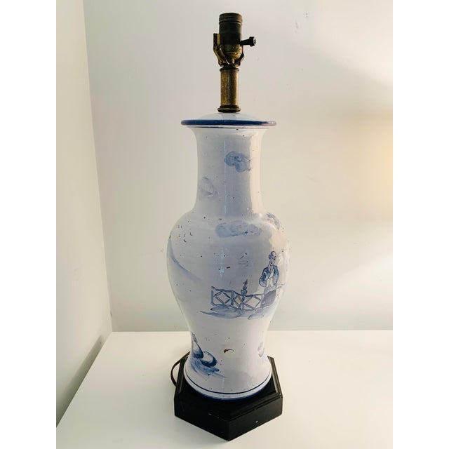 A lovely tall blue and white vintage earthenware gourd lamp. Hand painted figures in shades of blue. Earthenware has a...