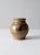 This is a vintage studio pottery vase. The hand-crafted ceramic vase features a speckled brown glaze with painted abstract...