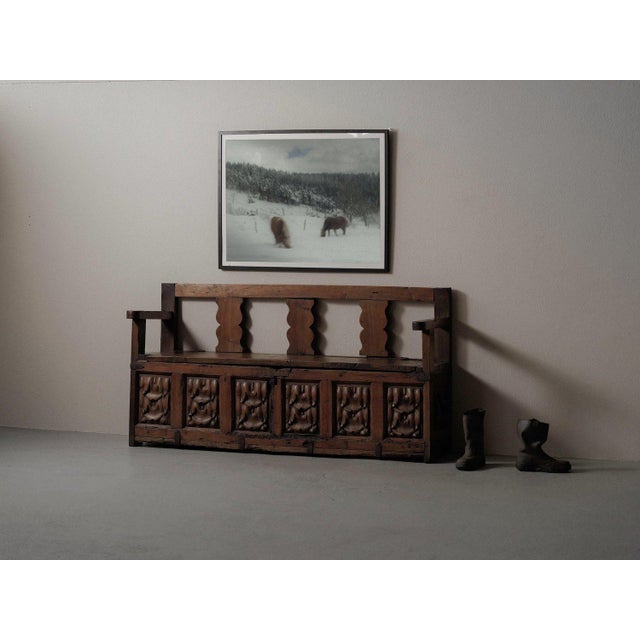 Large bench in solid pine and a harder wood resembling chestnut. The storage compartment is composed of 17th–18th-century...