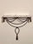 Italian gilt iron rope and tassel wall mount console with a white marble top, circa 1960s. An exquisite console of a full-...