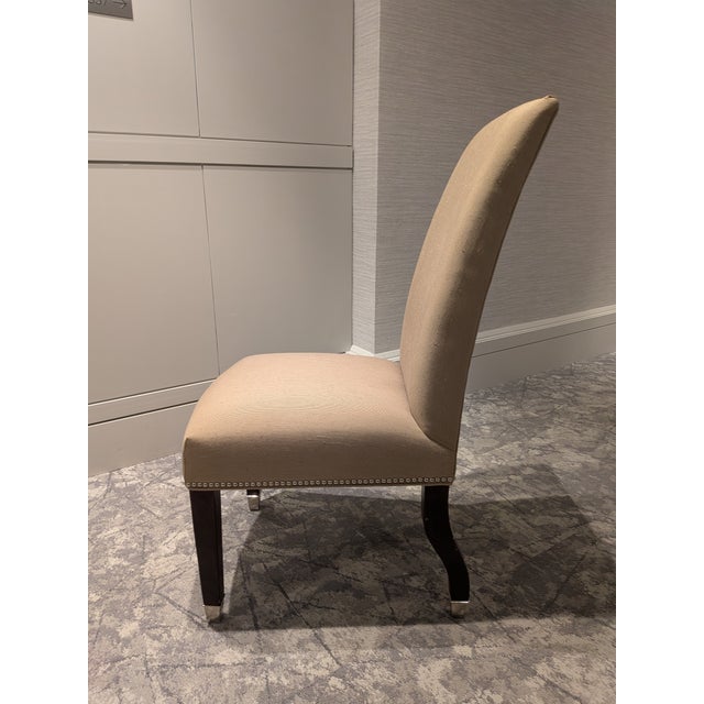 This comfortable, high-back chair has parson styling and is enhanced by nail-head seat trim with eye-catching 2" polished-...