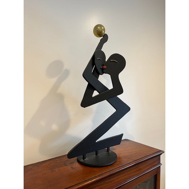 Unique Curtis Jere sculpture of a kissing couple. Black steel sculpture with whimsical sleek lines casting great shadows...