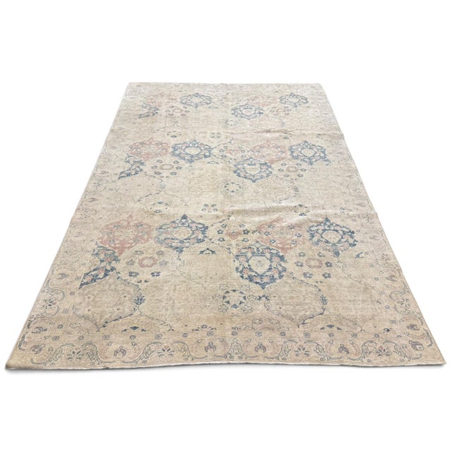 An antique Turkish Sivas rug with a beautifully softened palette and an intricate allover floral design. Set against an...
